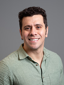 Franccesco Boeno indoor headshot.