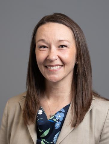 Headshot of Dr. Renee Davis in a studio in front of a grey backdrop