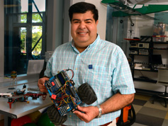 Dr. Khabou holding robot