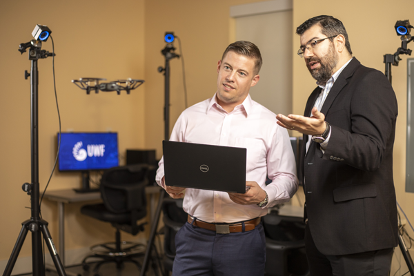 student and teacher testing a drone