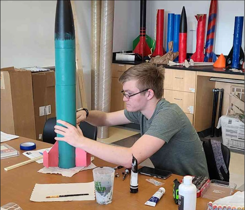 student building rocket