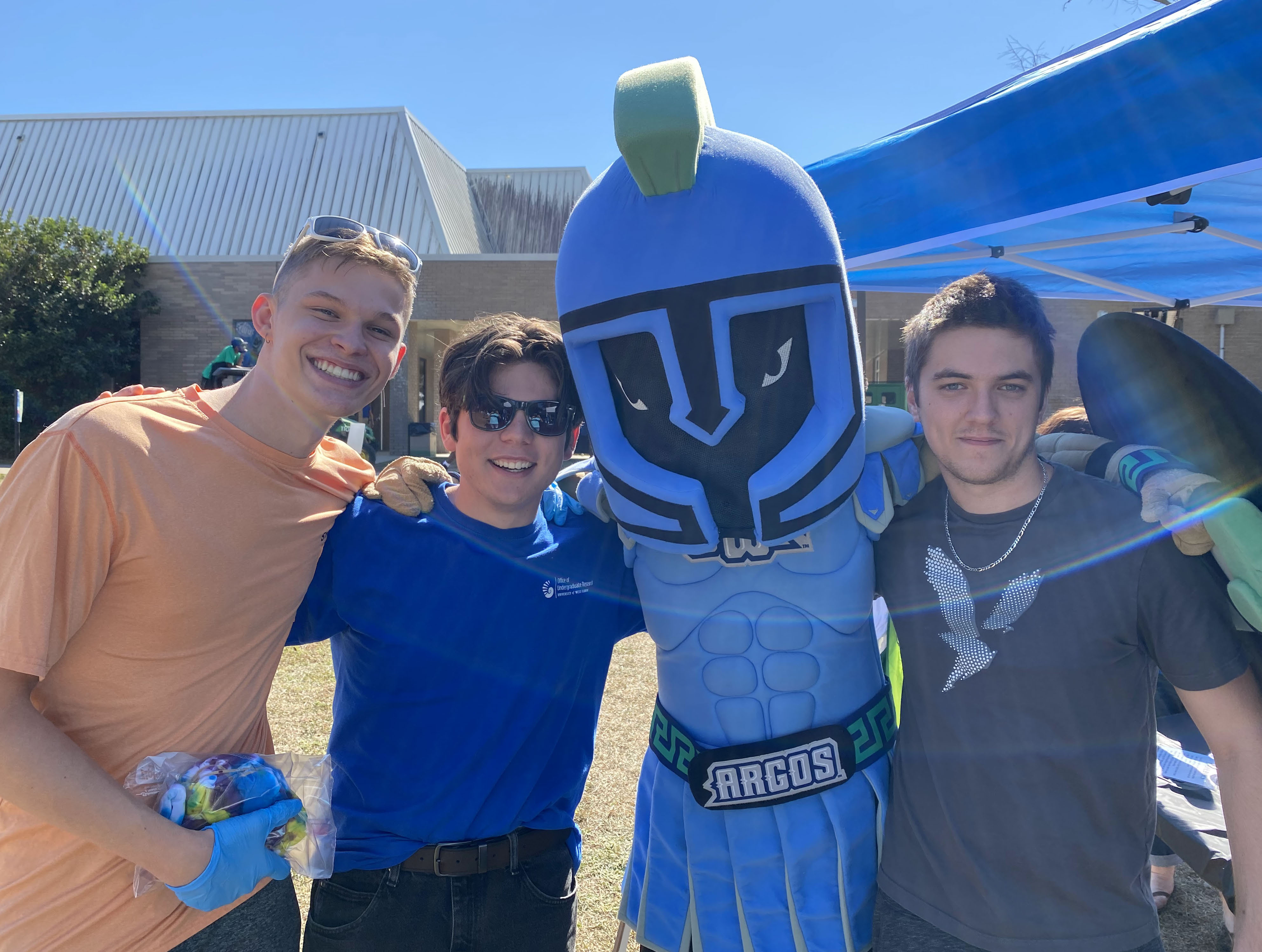 Zac Sanders, Charlie Womack, and Zach Patane with Argie at Tailgate