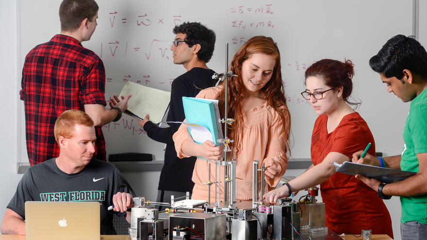 Multiple students in mechanical engineering lab