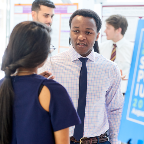 Students talking to each other at event