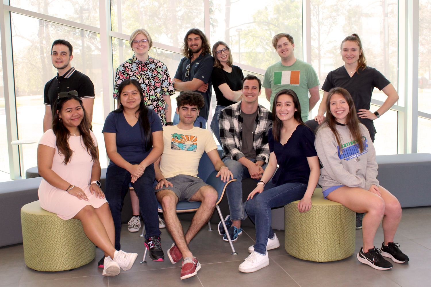 A group of 12 students in the lobby of 58C