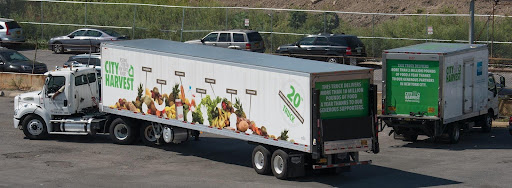 Eighteen-wheeler truck setting off to deliver veggies