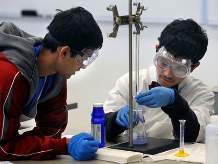 Aditya Srivastava and Teja Jakkala of Rickards High School in Tallahassee, compete in the chemistry competition Saturday during the Northwest Florida Regional Science Olympiad Competition at the University of West Florida.