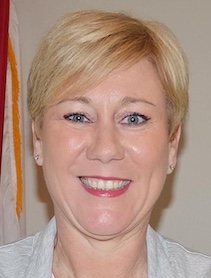 Headshot of woman with short blond hair