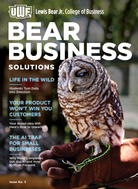 Owl perched on a gloved hand on a magazine cover.