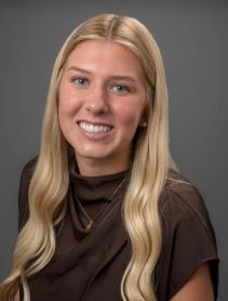 A student posing for a headshot