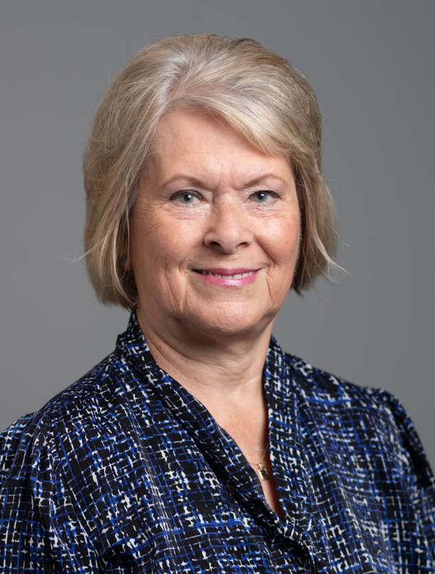 Headshot of woman wearing blue shirt