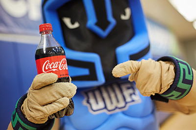 Argie, UWF's mascot, holding a Coca-Cola