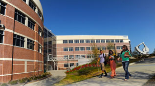 Photo of students walking by Science and Engineering building.