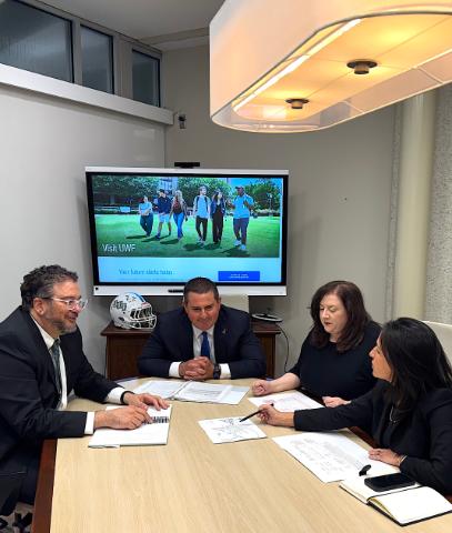 Sr Leaders at conference table having discussion