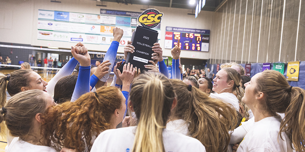 uwf volleyball team hoists the gulf south championship trophy