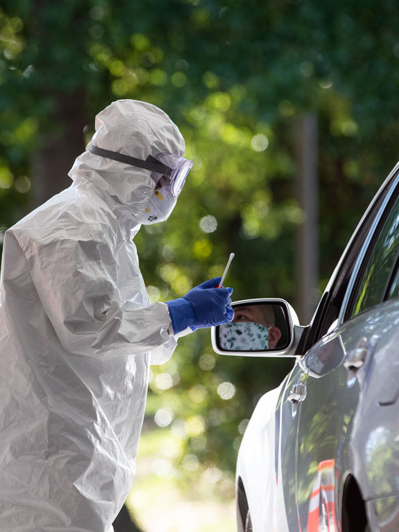 Epidemiologist conducting infectious disease testing at a COVID testing site.