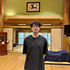 Tyler Howell standing in a traditional Japanese room.