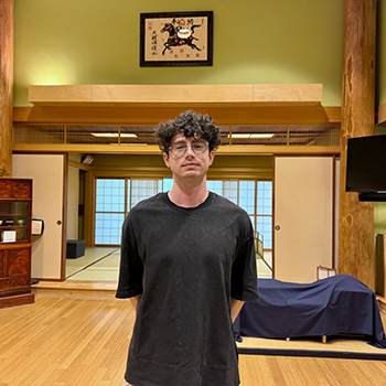 Tyler Howell standing in a traditional Japanese room.