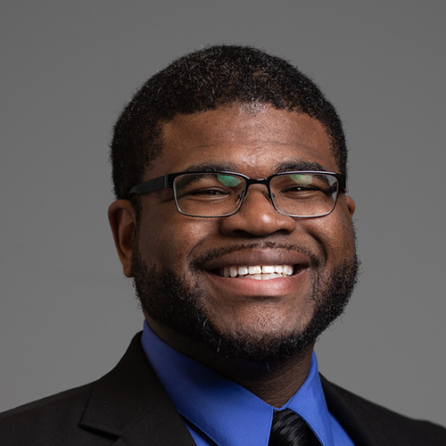 Amos Davidson indoor headshot.