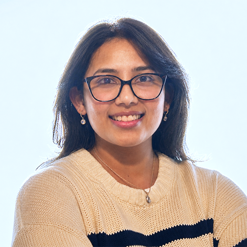 Asmita Karki indoor headshot.