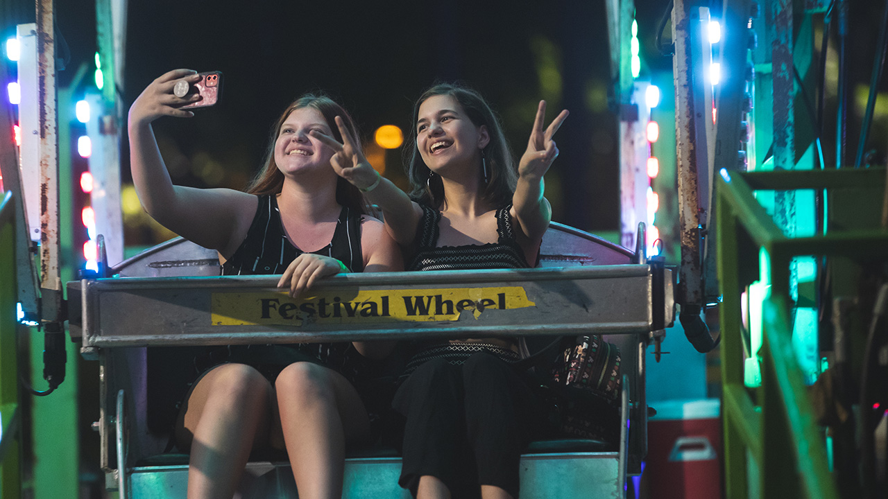 People sitting on the ferris wheel