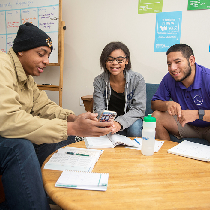 Students looking at an event on Handshake