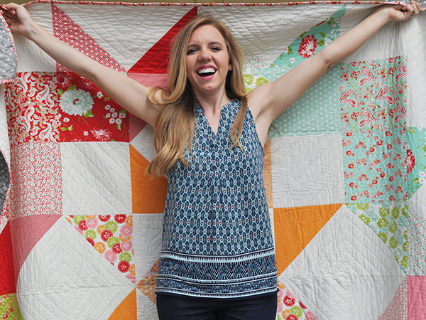emily dennis in front of a quilt