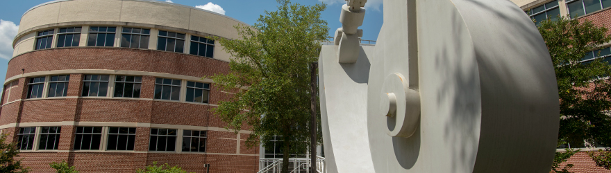 Statue outside the Hal Marcus College of Science & Engineering building