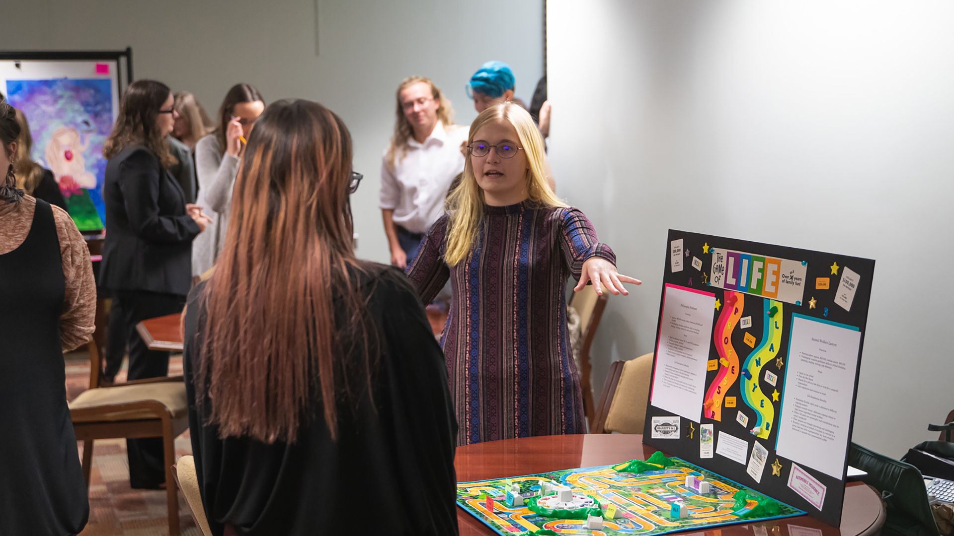 People displaying exhibits in the Great Good Place.