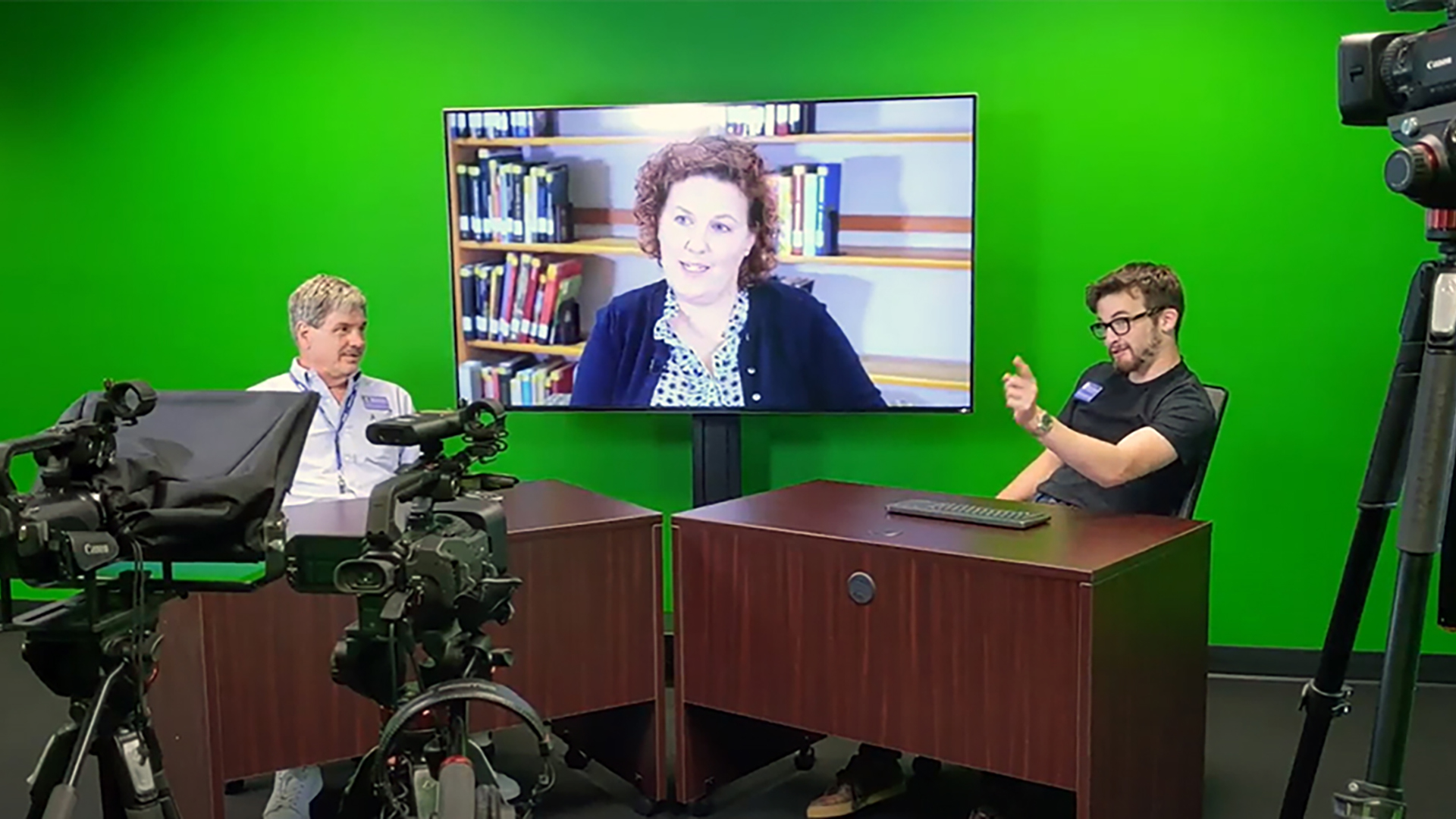 People conducting an interview in the library studio.