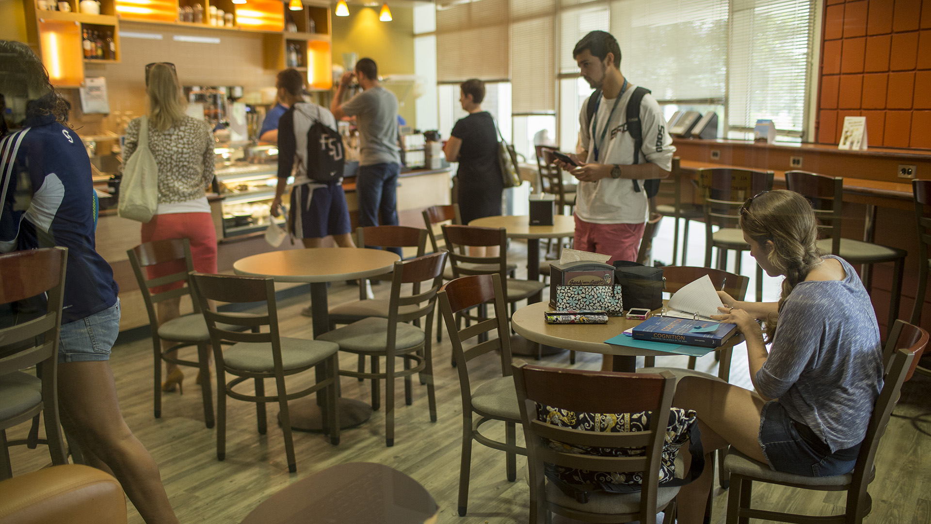 Interior shot of the Pace Coffee House filled with people enjoying coffee.