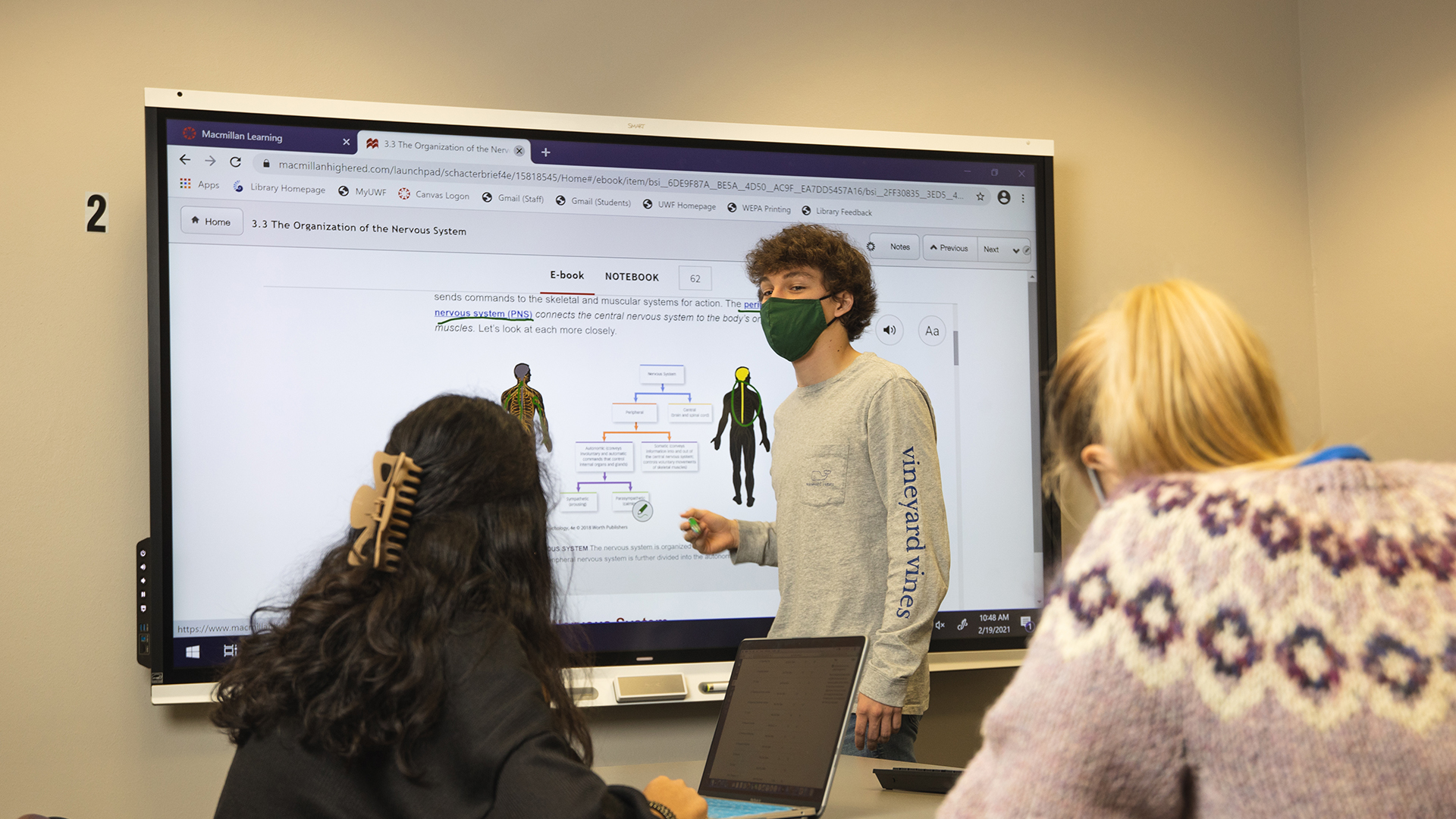 Students using SMART Boards in the library.