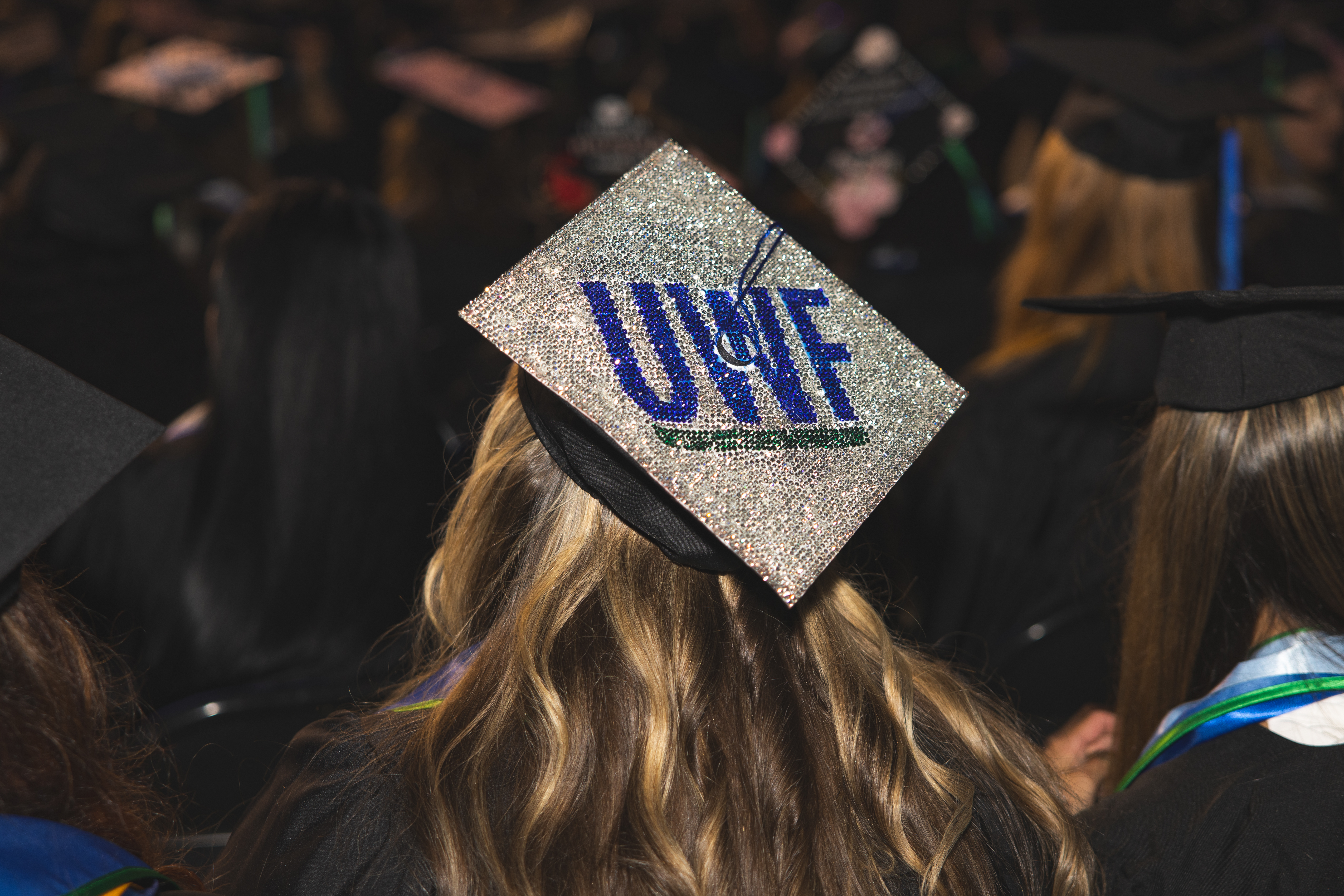 Graduation cap decorated with the UWF logo.