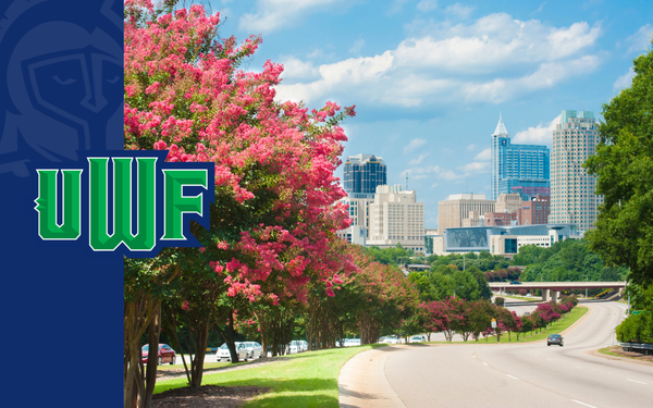 UWF graphic featuring the Raleigh skyline along a tree-lined road under a bright blue sky.