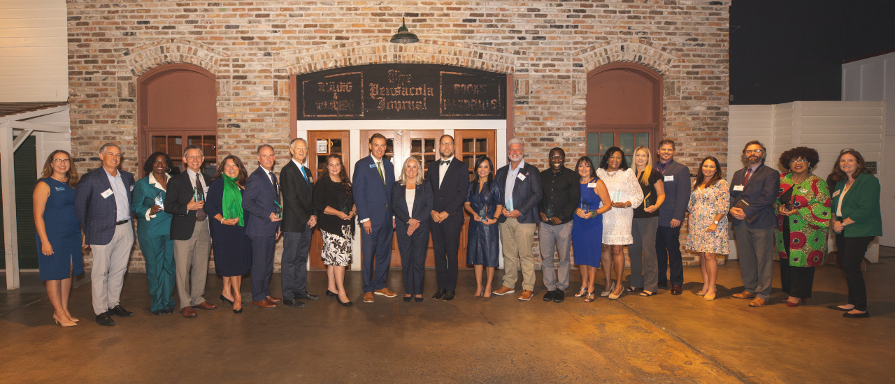A group photo of all of the Spirit of UWF award winners from the 2023 luncheon, plus UWF dignitaries