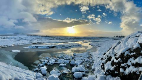 A stunning photo capturing icebergs floating in the water.