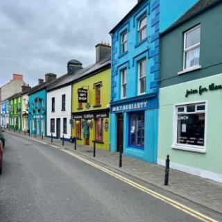 A street view of colorful shops in Ireland