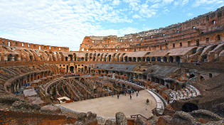 View of the inside of the Coliseum showcasing the entire area with a picturesque blue sky in the background