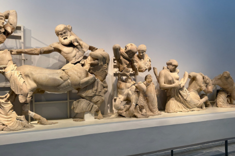 Ancient statues depict a Greek myth inside the museum at ancient Olympia.