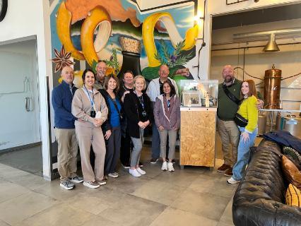 Argo pose at a gin distillery.
