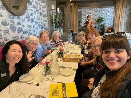 A group of Argo travelers have dinner in Scotland