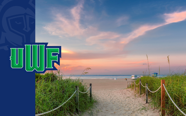 Sandy beach access path leading to the Gulf at sunset, bordered by sea oats, with a UWF logo on the left.