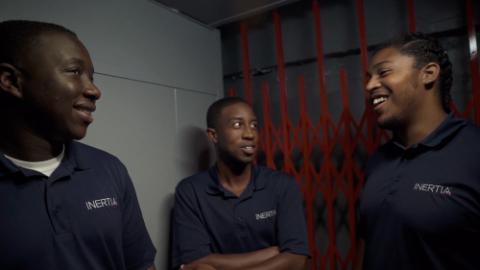 Basil Kuloba and two others wearing Inertia polo shirts