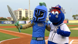 Argie stands next to the Blue Wahoos mascot on the baseball field.