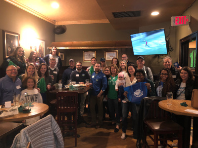 A group of alumni that live in Washington DC pose for a photo at the 2018 watch party.