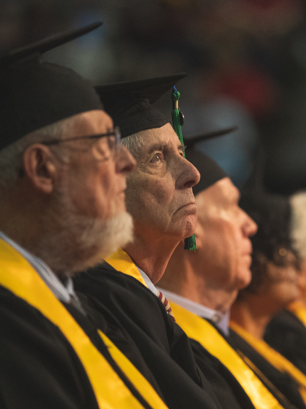 Golden Graduates sit in the front row at UWF Fall Commencement