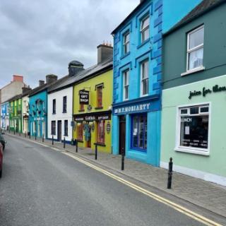 A street view of colorful shops in Ireland