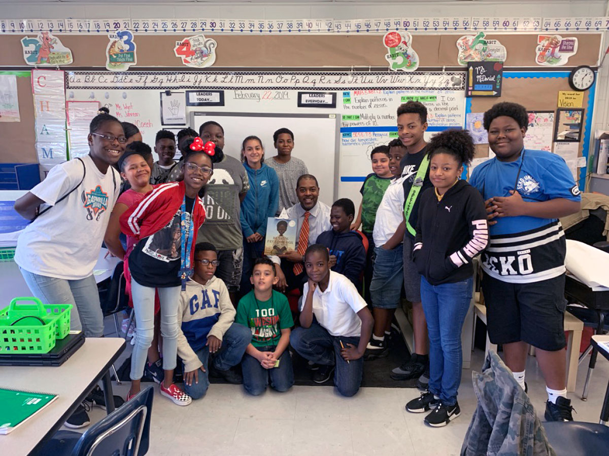 Group photo of students in a classroom