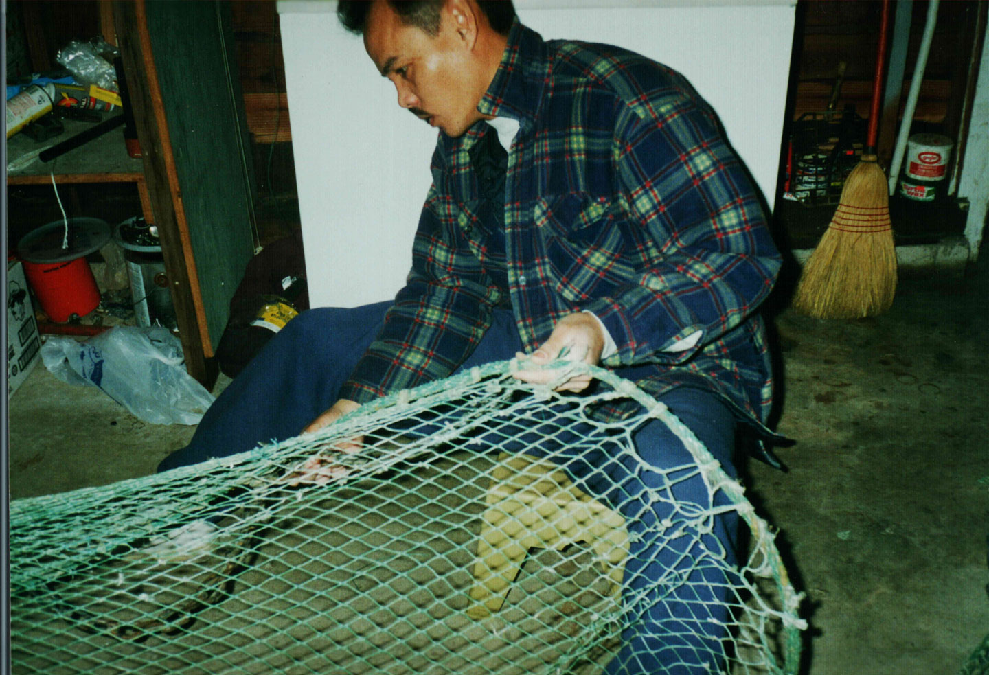 Hong’s dad working on shrimp net