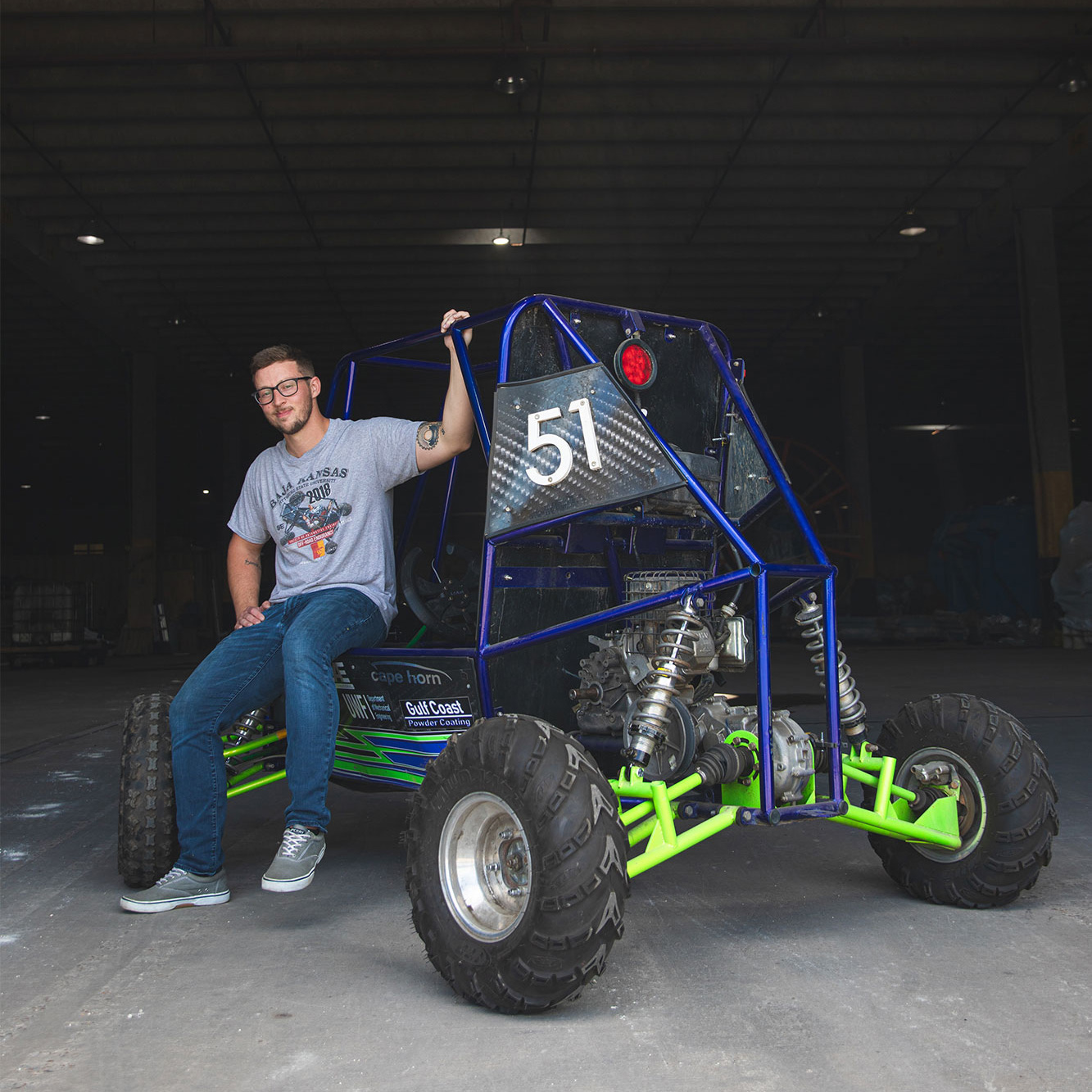 Steven with the off-road vehicle he fabricated when he was team captain of the UWF SAE Baja team.